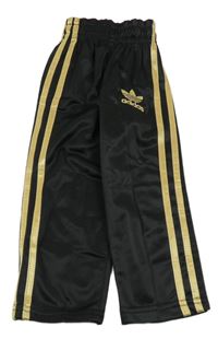 Černo-zlaté tepláky s pruhy Adidas