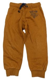 Skořicové tepláky s nápisy H&M