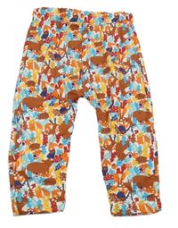 Bílo-barevné tepláky se zvířaty a listy