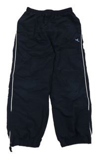 Tmavomodré šušťákové nohavice s proužkem