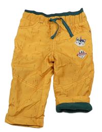 Okrovo-tmavozelené šušťákové podšité nohavice s nášivkami Ergee