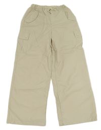 Smotanové šušťákové voľné é nohavice s vreckami Rolanko