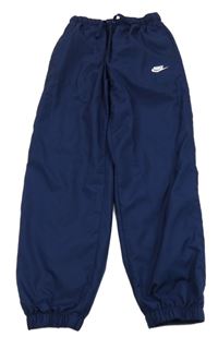 Tmavomodré šusťákové podšité kalhoty Nike