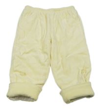 Žluté sametové zateplené tepláky s mašlemi