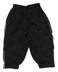 Čierne šušťákové podšité nohavice