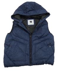 Tmavomodrá šusťáková zateplená vesta s kapucí Tu