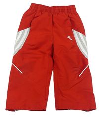 Červené šušťákové nohavice zn. Adidas