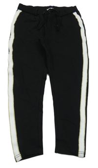 Čierno-bielo-zlaté teplákové nohavice s pruhmi Name it