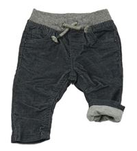 Tmavomodré podšité manšestráky s úpletovým pasem C&A