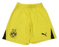 Žluté sportovní fotbalové kraťasy s logem Puma 