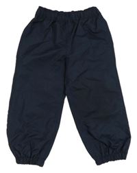 Tmavomodré šusťákové podšité kalhoty Okaidi