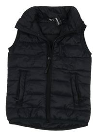 Tmavomodrá šusťáková prošívaná vesta 