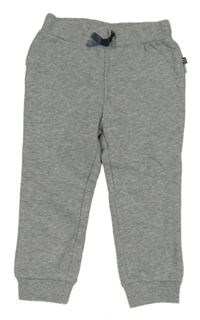 Šedé melírované tepláky s volánky 