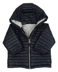 Tmavomodrá šusťáková lehce zateplená prošívaná bunda s kapucí Next