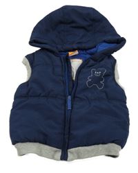 Tmavomodrá šusťáková zateplená vesta s medvídkem a kapucí Pusblu