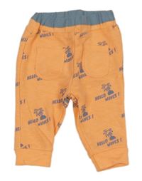 Neónově oranžové tepláky s palmami a nápismi