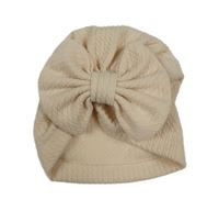 Béžová turbanová čapica s mašlou