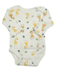 Bílé body s žirafami a listy