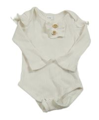 Smetanové žebrované body s volánky a knoflíky