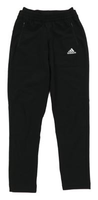 Černé šusťákové kalhoty s logem Adidas