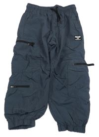 Tmavomodré šušťákové podšité nohavice s vreckami Next