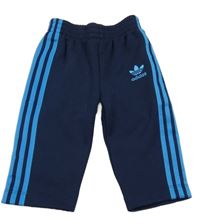 Tmavomodré tepláky s pruhmi a logem - Adidas