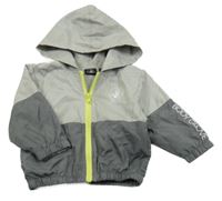 Šedo-tmavošedá šusťáková jarní bunda s potiskem a kapucí 