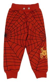 Červené vzorované tepláky s pavoukem