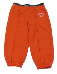 Červené tepláky s nápisem v pase River Island