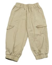 Béžové cargo šušťákové nohavice s falešnými vreckami