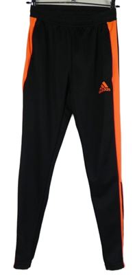 Dámské černo-oranžové sportovní funkční tepláky s pruhy Adidas 