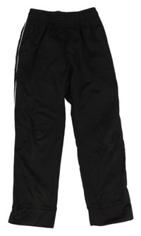 Čierne športové tepláky s pruhmi Decathlon