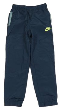Tmavomodré šusťákové podšité kalhoty s logem Nike