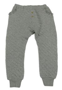 Sivé prešívané tepláky s volánikmi Next