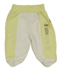 Žluto-bílé teplákové polodupky s nápisy 