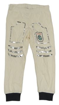 Smetanovo-tmavomodré tepláky s potlačou