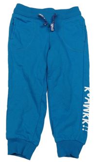 Azurové tepláky s nápisem Pocopiano