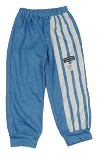 Modré tepláky s nášivkami a bílými pruhy SHEIN