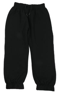 Čierne slabé vzorované nohavice Tu