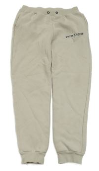 Béžové tepláky s nápisem Palm Angels