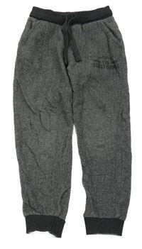 Šedo-bílé vzorované kalhoty s nápisy Topolino