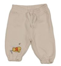 Světlerůžové tepláky s medvídkem Pú Primark