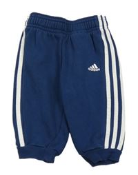 Tmavomodré tepláky s pruhy a logem Adidas