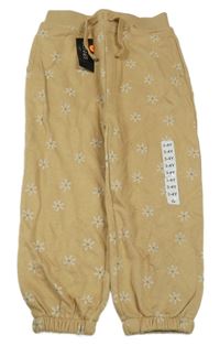 Nové - hnědé tepláky s květy St. Bernard