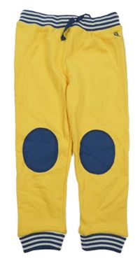 Nové - tmavožluto/tmavomodro-biele tepláky s drakom a pruhmi KITE