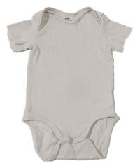Světlebéžové body H&M