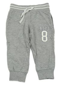 Světlešedé tepláky s číslem 