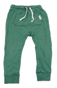 Tmavozelené turecké tepláky s kapsou H&M