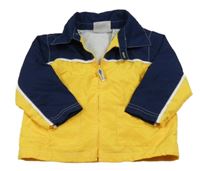 Hořčicovo-tmavomodrá šušťáková jarná bunda