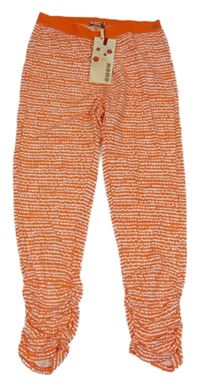 Nové - Oranžovo-bílé vzorované crop legíny